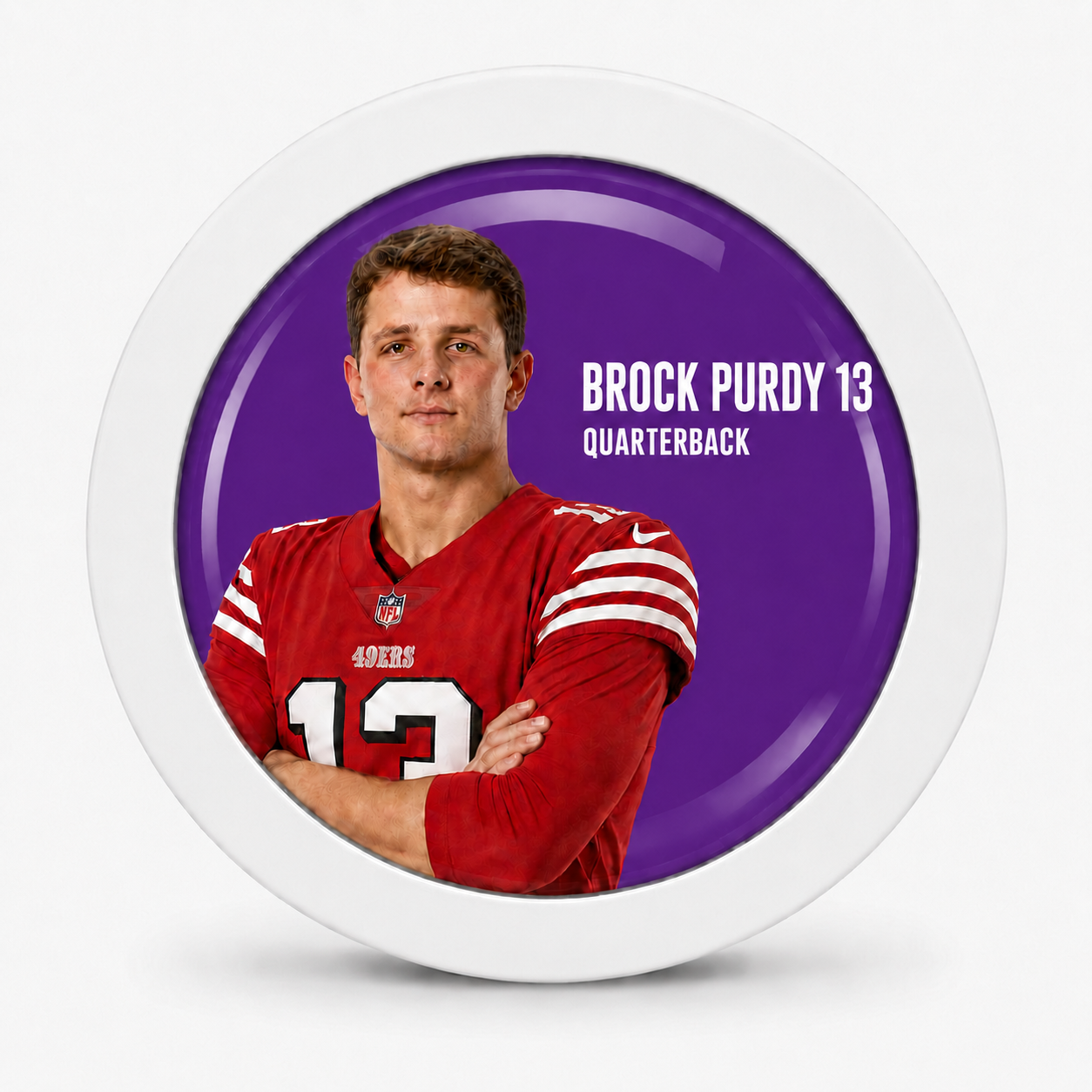 Rodela badge with Brock Purdy in a red 49ers jersey on a purple background