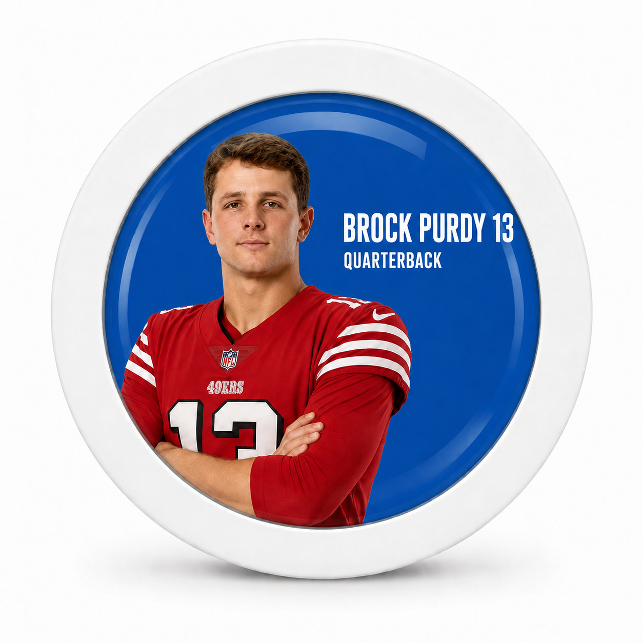 Rodela badge with Brock Purdy in a red 49ers jersey on a blue background